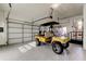 Spacious garage with golf cart and automatic door opener at 436 Lafayette Blvd, Oldsmar, FL 34677