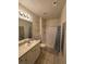 Bathroom with shower, vanity, and mirror at 1216 S Missouri Ave # 317, Clearwater, FL 33756