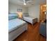 Bedroom with two twin beds and wood floors at 1216 S Missouri Ave # 317, Clearwater, FL 33756