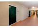 Apartment building hallway with green door at 1216 S Missouri Ave # 317, Clearwater, FL 33756