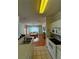 Kitchen with view into living room and access to laundry at 1216 S Missouri Ave # 317, Clearwater, FL 33756