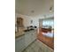 Open kitchen with view of living room and hardwood floors at 1216 S Missouri Ave # 317, Clearwater, FL 33756