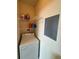 Well-lit laundry room with washer, dryer, and shelving at 1216 S Missouri Ave # 317, Clearwater, FL 33756