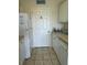 Small laundry room with washer and dryer hookups at 1216 S Missouri Ave # 317, Clearwater, FL 33756