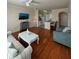 Living room with hardwood floors and open kitchen at 1216 S Missouri Ave # 317, Clearwater, FL 33756