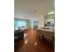 Living room with hardwood floors and open kitchen at 1216 S Missouri Ave # 317, Clearwater, FL 33756