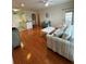 Open concept living area with hardwood floors and access to kitchen at 1216 S Missouri Ave # 317, Clearwater, FL 33756