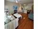 Living room with hardwood floors and open kitchen at 1216 S Missouri Ave # 317, Clearwater, FL 33756