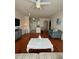 Living room with hardwood floors and open kitchen at 1216 S Missouri Ave # 317, Clearwater, FL 33756