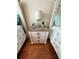 Nightstand with lamp and clock at 1216 S Missouri Ave # 317, Clearwater, FL 33756