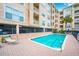 Community pool with lounge chairs at 1216 S Missouri Ave # 317, Clearwater, FL 33756