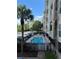 Community pool with surrounding patio at 1216 S Missouri Ave # 317, Clearwater, FL 33756