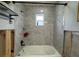 Updated bathroom with a new bathtub and tile at 4549 Ontario Dr, New Port Richey, FL 34652