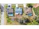 Aerial view of homes with pools in a residential neighborhood at 6085 Fall River Dr, New Port Richey, FL 34655