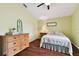 Charming bedroom with hardwood floors, ample natural light, and a cozy ambiance with light green walls at 106 Rosana Dr, Brandon, FL 33511