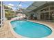 Inviting backyard pool is enclosed with a screened lanai and brick paver patio at 106 Rosana Dr, Brandon, FL 33511