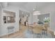 Open concept dining area with a view into the kitchen at 1615 Santa Barbara Dr, Dunedin, FL 34698