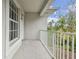 Private balcony with white railing overlooking trees at 2632 River Preserve Ct, Bradenton, FL 34208