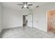 Bedroom with bathroom access and tile floors at 2632 River Preserve Ct, Bradenton, FL 34208