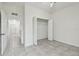 Bedroom with walk-in closet and tile floors at 2632 River Preserve Ct, Bradenton, FL 34208