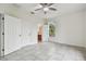 Bright bedroom with tile floors and bathroom access at 2632 River Preserve Ct, Bradenton, FL 34208