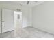 Simple bedroom with ceiling fan and tile floors at 2632 River Preserve Ct, Bradenton, FL 34208