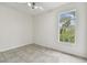 Spacious bedroom with tile floors and window at 2632 River Preserve Ct, Bradenton, FL 34208