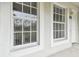 Condo exterior featuring white building, windows, and entrance at 2632 River Preserve Ct, Bradenton, FL 34208