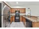 Modern kitchen with granite counters and black appliances at 2632 River Preserve Ct, Bradenton, FL 34208
