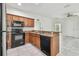 Updated kitchen with wood cabinets and granite countertops at 2632 River Preserve Ct, Bradenton, FL 34208