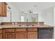 Granite countertop kitchen with stainless steel sink and dishwasher at 2632 River Preserve Ct, Bradenton, FL 34208
