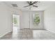 Bright living room with tile floors and access to balcony at 2632 River Preserve Ct, Bradenton, FL 34208