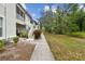 Sidewalk leading to condo entrance with landscaping at 2632 River Preserve Ct, Bradenton, FL 34208