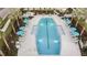 Resort-style pool with plenty of lounge chairs and umbrellas at 3716 Maxwell Park Dr, Sun City Center, FL 33573