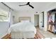 Bright bedroom featuring a queen bed and walk-in closet at 1948 Jeffords St, Clearwater, FL 33764