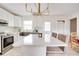 Stylish kitchen with island, stainless steel appliances, and white cabinets at 1948 Jeffords St, Clearwater, FL 33764