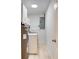 Well-lit laundry room with new washer and dryer at 1948 Jeffords St, Clearwater, FL 33764