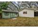 Green storage shed in grassy backyard at 3322 W Dorchester St, Tampa, FL 33611