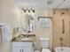 Clean bathroom with tub, granite vanity and mirror at 12000 Gulf Blvd # 501-W, Treasure Island, FL 33706