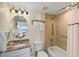 Clean bathroom with granite vanity and tub at 12000 Gulf Blvd # 501-W, Treasure Island, FL 33706