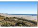 Stunning panoramic view of the ocean and beach from a beachfront property at 12000 Gulf Blvd # 501-W, Treasure Island, FL 33706