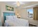 Cozy bedroom with a comfortable bed and ocean view at 12000 Gulf Blvd # 501-W, Treasure Island, FL 33706