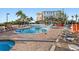 Resort-style pool with hot tub and lounge chairs at 12000 Gulf Blvd # 501-W, Treasure Island, FL 33706