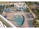 Community pool and spa with lounge chairs at 12000 Gulf Blvd # 501-W, Treasure Island, FL 33706