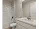 Clean bathroom with white vanity, quartz countertop and tiled shower/tub at 20363 Symphony Pl, Venice, FL 34293