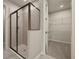 Bathroom with shower and walk-in closet at 20363 Symphony Pl, Venice, FL 34293