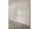 Spacious bedroom with ample closet space and neutral carpeting at 20363 Symphony Pl, Venice, FL 34293