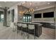 Modern clubhouse bar with granite countertop and stylish pendant lights at 20363 Symphony Pl, Venice, FL 34293