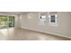 Spacious dining area with tile floors and sliding glass doors to backyard at 20363 Symphony Pl, Venice, FL 34293