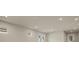 Open concept living area with recessed lighting and neutral paint at 20363 Symphony Pl, Venice, FL 34293